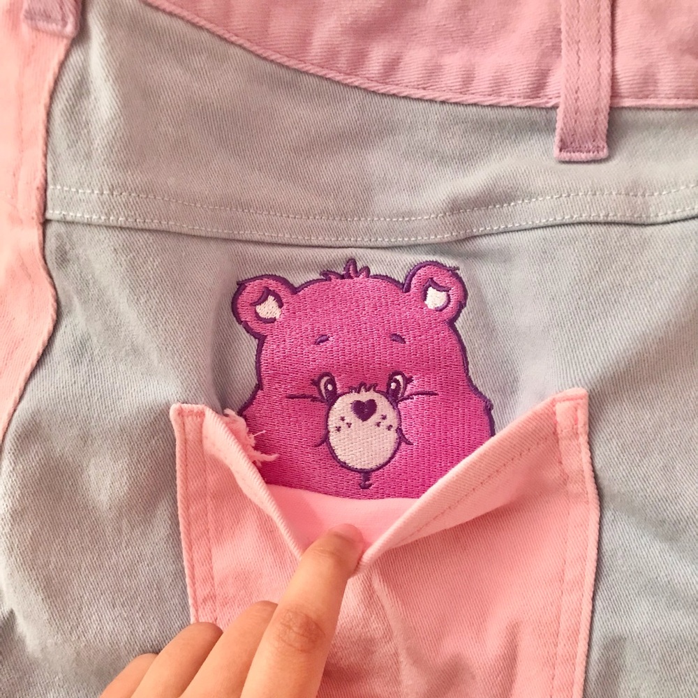 Dolls Kill x Care Bears just add love color block shorts